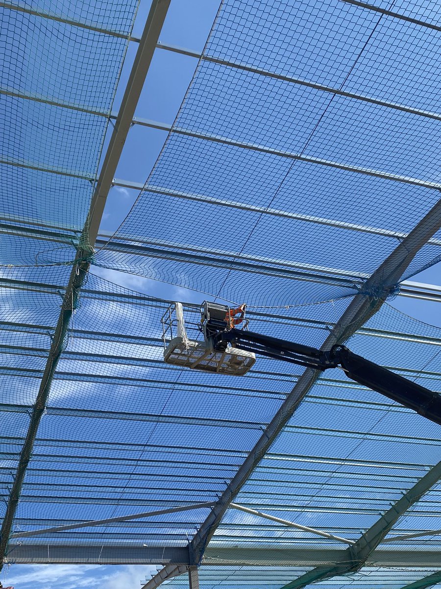 3education's tweet photo. A bit of blue sky always makes nets look good! Scott Webb of I-Scaff lacing two nets together as part of his NVQ assessment. NVQ’s are the only route to a net rigging qualification and the process doesn’t hold back productivity. #faset #safetynetrigger #training #assessment #NVQ https://t.co/6itf5DtxYg