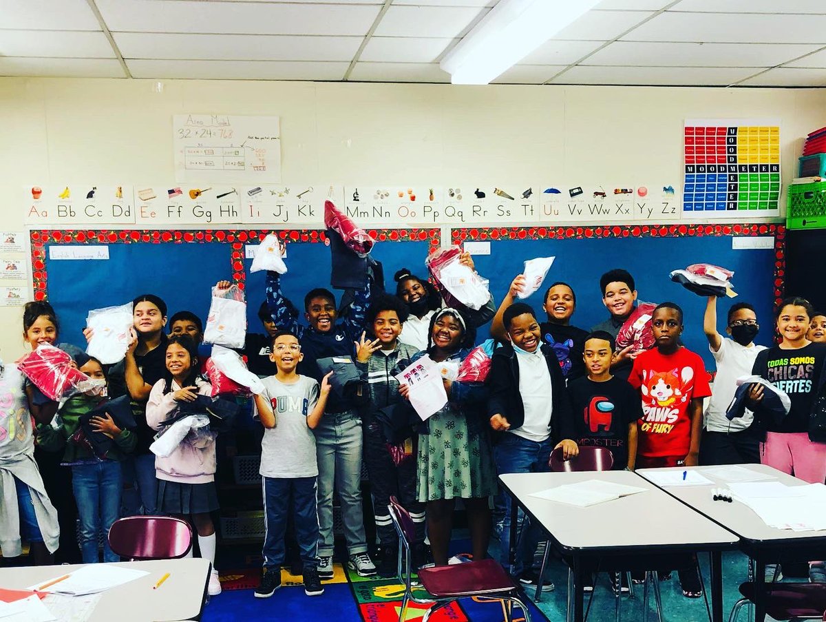 BxPs70's tweet photo. 5th graders excited to receive their free uniforms. Wear them proudly! ❤️🤍❤️ https://t.co/SoagXweL04