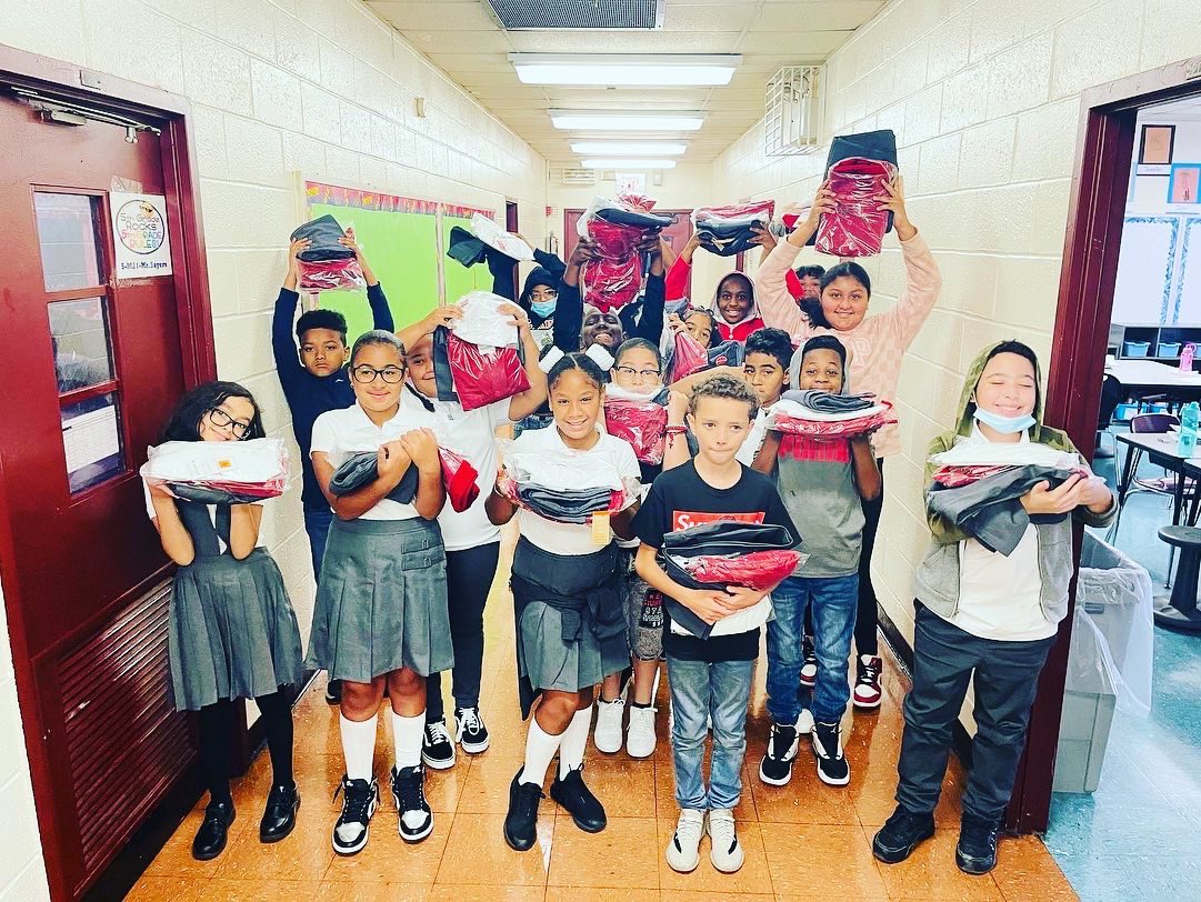 BxPs70's tweet photo. 5th graders excited to receive their free uniforms. Wear them proudly! ❤️🤍❤️ https://t.co/SoagXweL04