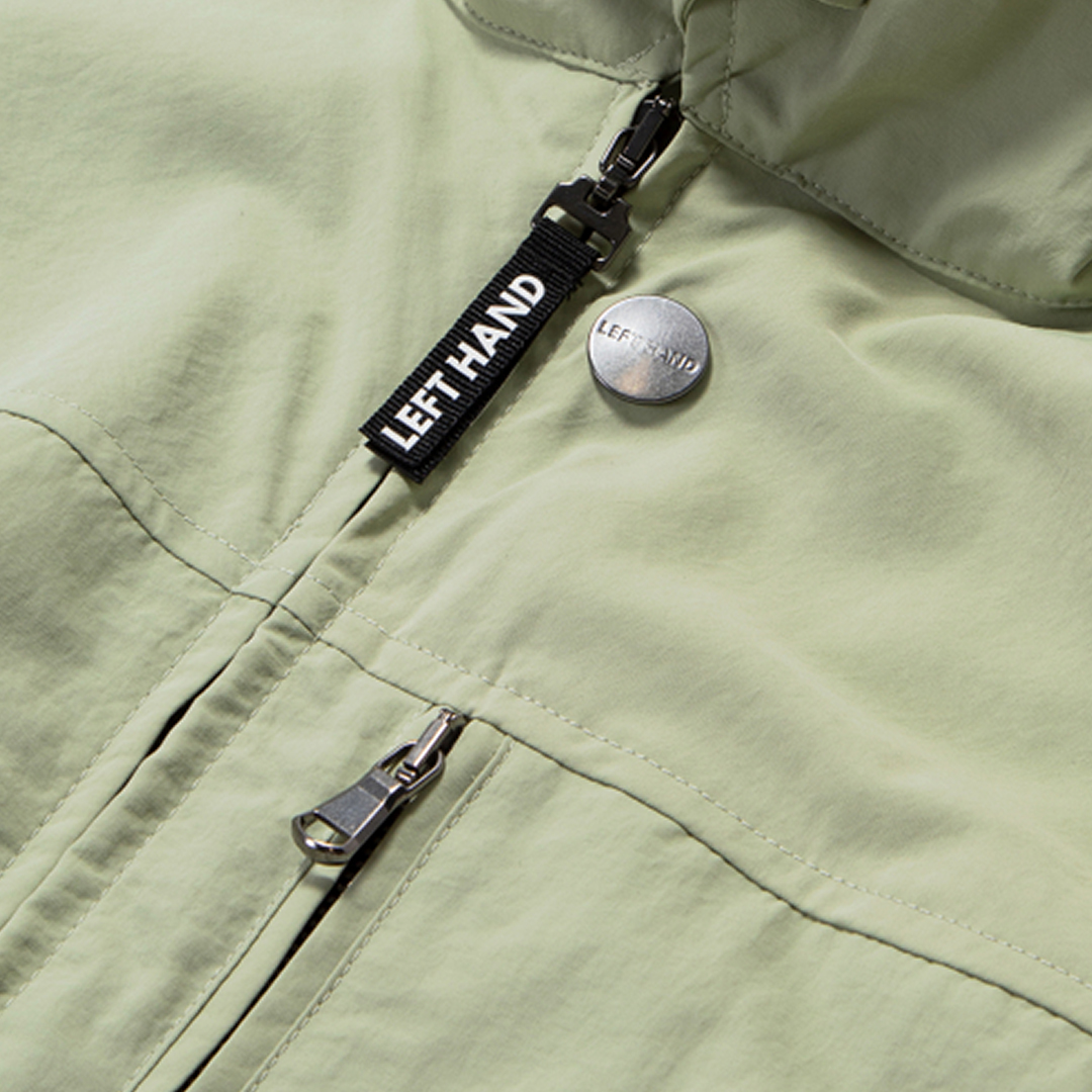 The wonder Left Hand Lys jacket made with recycled fabrics YKK zip pulls with brand stud detail, available in two colours light green and Khaki #lefthand #lefthandsportswear #lefthandstudio designed by Christopher Raeburn #raeburnlab #raeburndesign #christopherraeburn