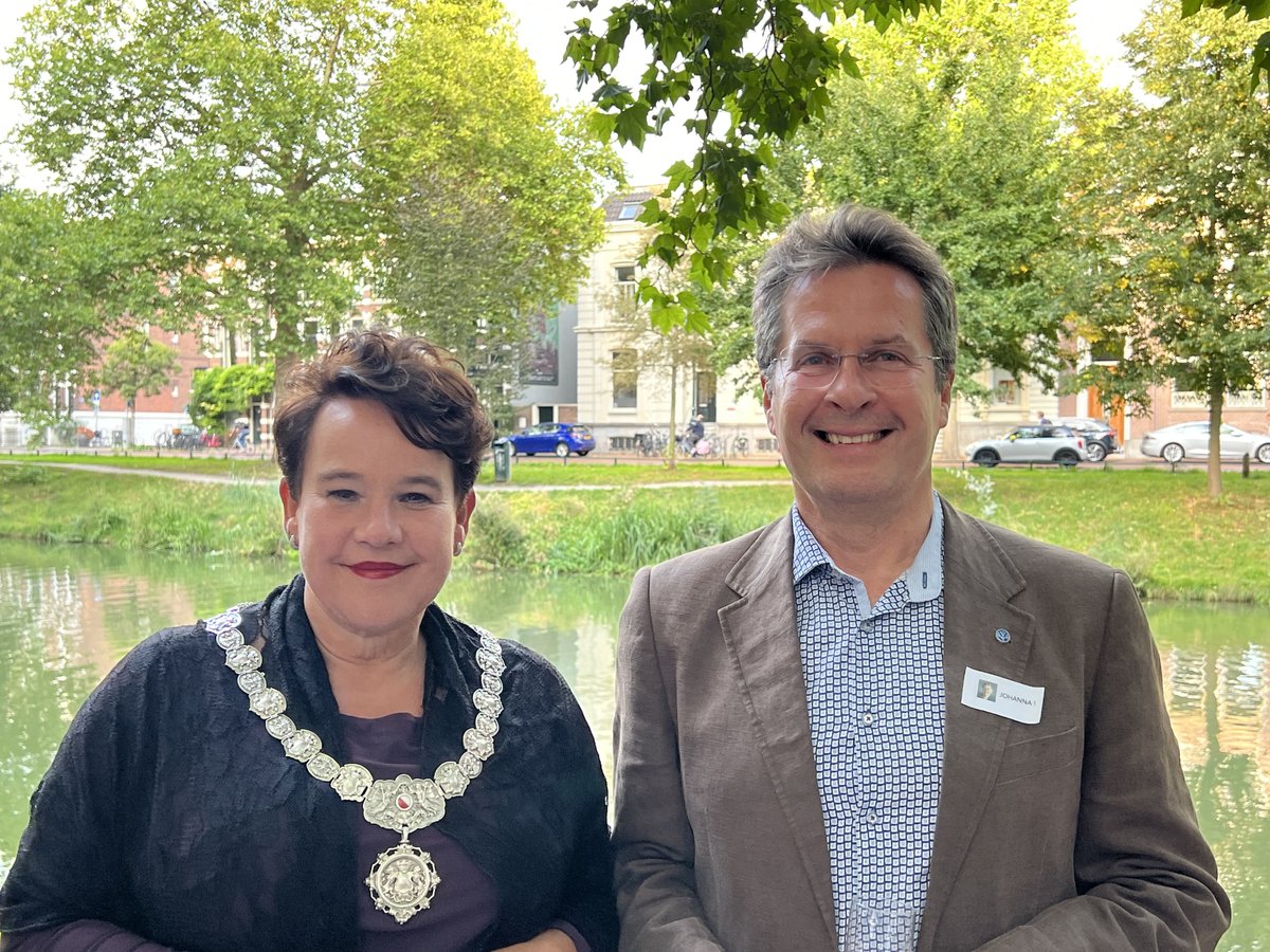 _Westerdijk_'s tweet photo. You might think that Mayor Dijksma and @FungusCrous are alone in this picture, but #JohannaWesterdijk is watching from the background too! First person spotting her wins a pair of @_Westerdijk_ socks 😀. PS: it is NOT the sticker on Pedro Crous' jacket.. https://t.co/NIWoIouucT
