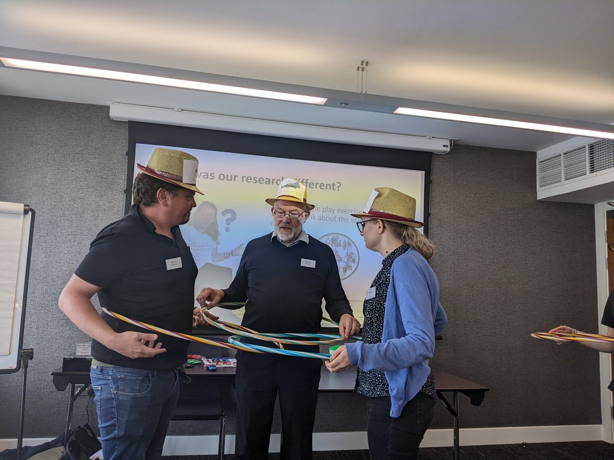 Barod_CIC's tweet image. So everyone wanted to know what the hula hoops were for! Simon, Bryan and a willing volunteer enacting Barod&apos;s your space - my space - shared space idea of coproduction at #MethodsCon this week - the hats were cool too!