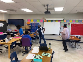 WilliamAcademy's tweet photo. Teachers collaborating and discussing PDSA cycle. #PowerofOne  @jjgerwig @jerzeeme https://t.co/byL2H2ilIm