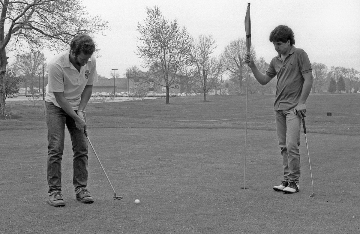 salemccnj's tweet photo. Today’s pic from the late 1980s shows two members of the College’s golf team practicing on the nearby Sakima Country Club golf course. In the background is Contini Hall. The team won the NJCAA Region 19 championships in 1981 and 1982, and took second place in 1983.
#tbt #SCC50 https://t.co/lPnoQABVXa