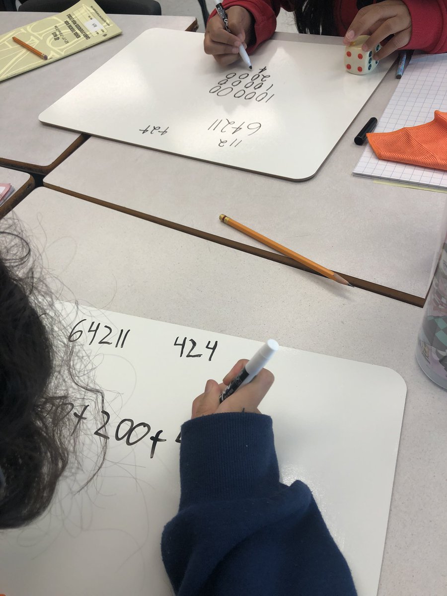 MrsVarvaresos's tweet photo. What do we remember about place value? How many different ways can we represent a number? What is the biggest and smallest number we can make with the 4 or 5 digits we have chosen? Lots of learning happening! @BerriganSchool @OCDSB https://t.co/tiHAZD0cim