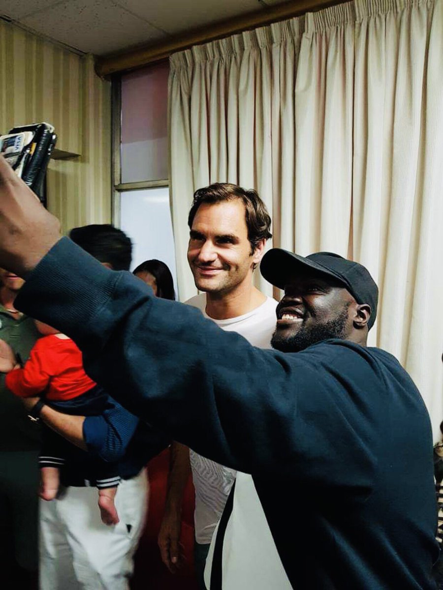 FirstZambian's tweet photo. Throwback with my friend Roger Federer. Happy retirement buddy. #FedExpress https://t.co/HREo2tN8LV