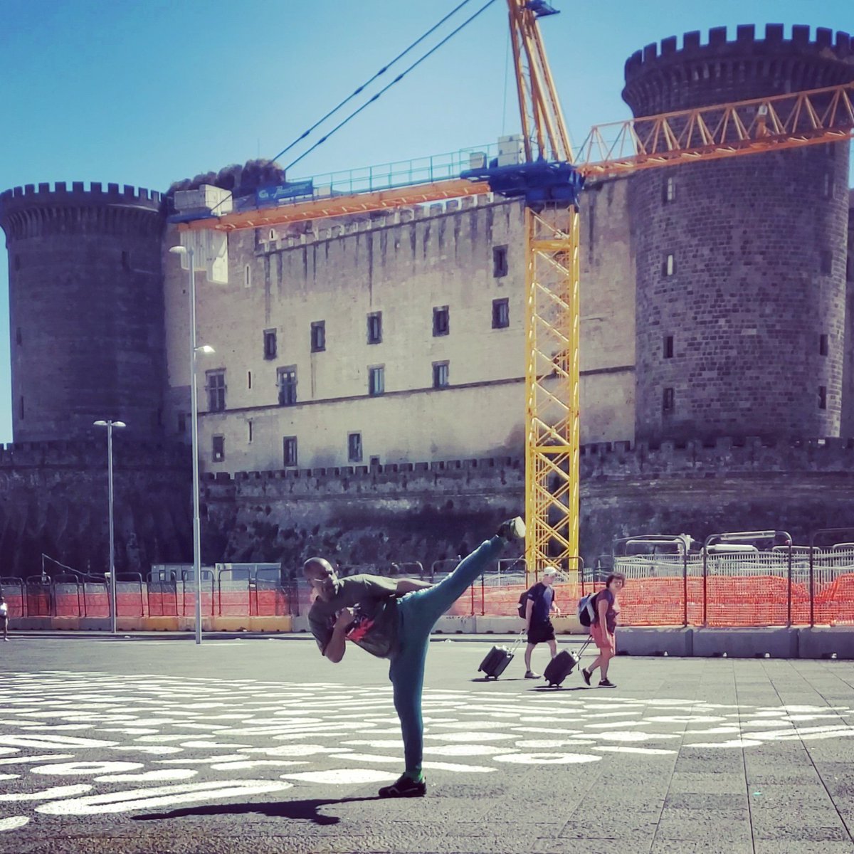 TEMPHUiBIS's tweet photo. I've been kicking again and trying to get back into my stretching routine. I'm happy with this kick in Italy in front of Castel Nuovo but I won't be satisfied until I beat my kick in Liverpool! #italy #naples #castelnuovo #Kick #taekwondo #Sidekick #1stDan #blackbelt #MartialArts https://t.co/Eo7qgDTvZk