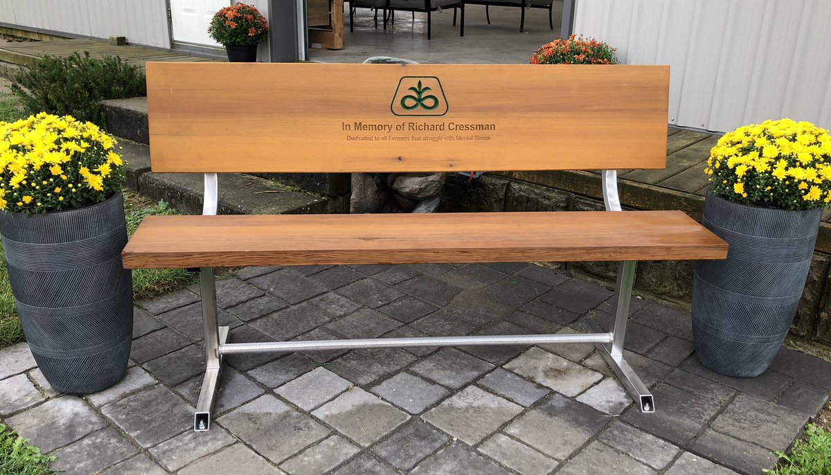 rfaust50's tweet photo. Honoured to have this bench at @PioneerSeedsCA site @outdoorfarmshow. In memory of Richard Cressman, former Pioneer rep &amp; dedicated to farmers that struggle with mental illness. To build resiliency for pain we need more benches &amp; open dialogue. @scressma @modernfarmer @domoreag https://t.co/ahz2gj8ocz