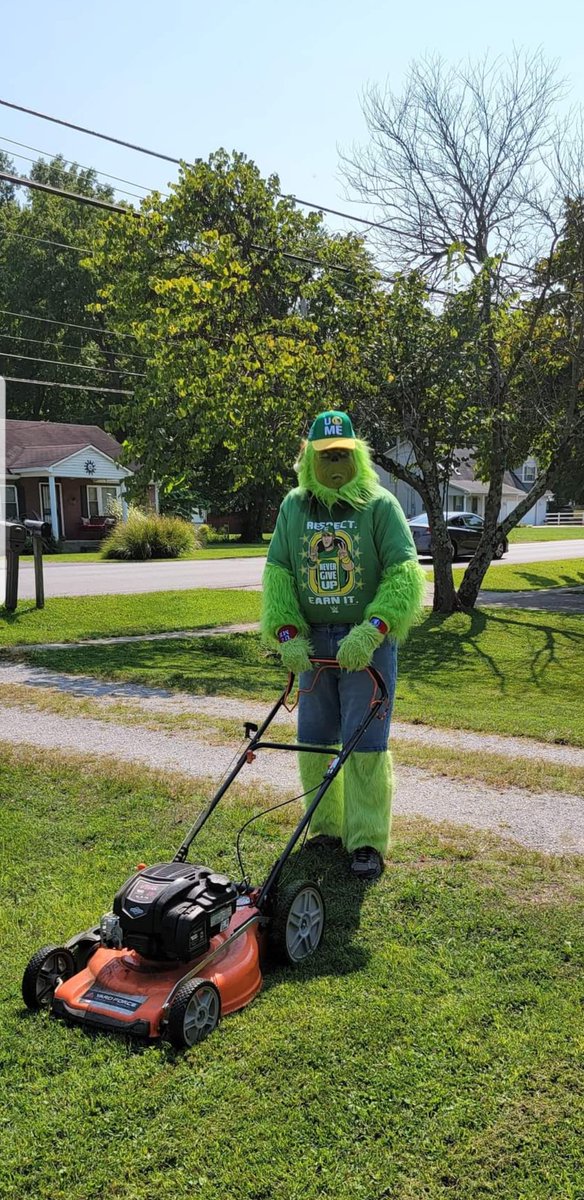 MeatBallMKE502's tweet photo. Mr Grinch dressed as @JohnCena while cutting grass https://t.co/ITiU2yQ4lk