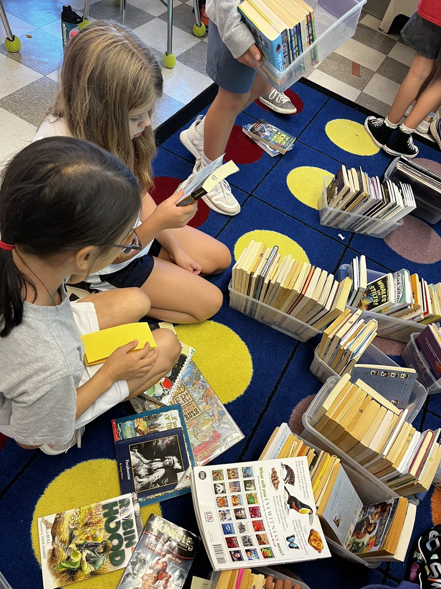 Working together to organize our library. Teamwork makes the dream work!