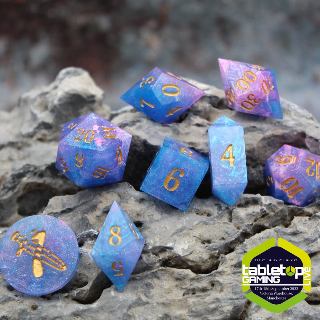 TabletopMag's tweet photo. 🎲 @DiceWAttitude is a small business dedicated to creating specialty handmade dice. They seek to create something truly one-of-a-kind for you to use during TTRPG games!

Find them and their creations on stand G92 at #TabletopGamingLive to find out more https://t.co/okIP25JMPa https://t.co/Wx6kp7R8xf