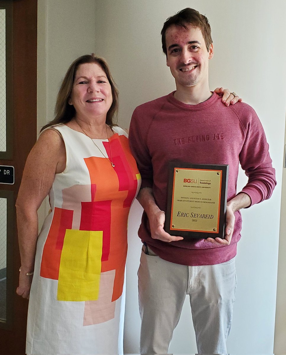 BGSU_Sociology's tweet photo. Congratulations to @Eric_E_Sevareid  who is this year's winner of the Donald J. and Susan E. Adamchak Graduate Student Award in Demography! Took awhile but we finally got his plaque! He is pictured here with his advisor, @monicalongmore. https://t.co/2oihjCYoaH