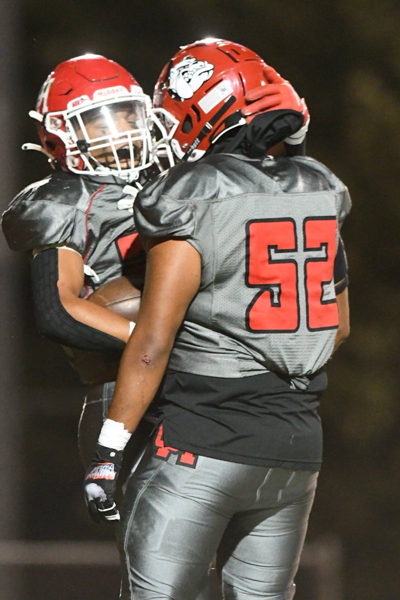 DPPhotoTeam's tweet image. Oak Hills Isaac Vicario, right, congratulates Shaylon You g after young scored against St Bonaventura on Thursday night. Bulldogs up 21-7 at halftime. (James Quigg for the Daily Press) @DP_JoseQ @DPSports @OHHS_FB_Booster @OakHillsFootba1 #ohhs #football
