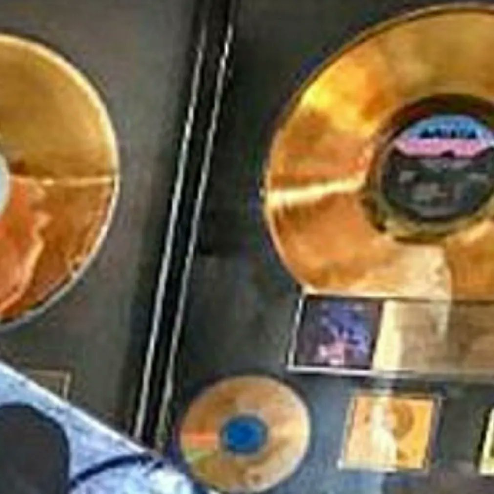 So geeked out that I scored this RIAA award and found a photo of it in situ with Jonny Z in his office