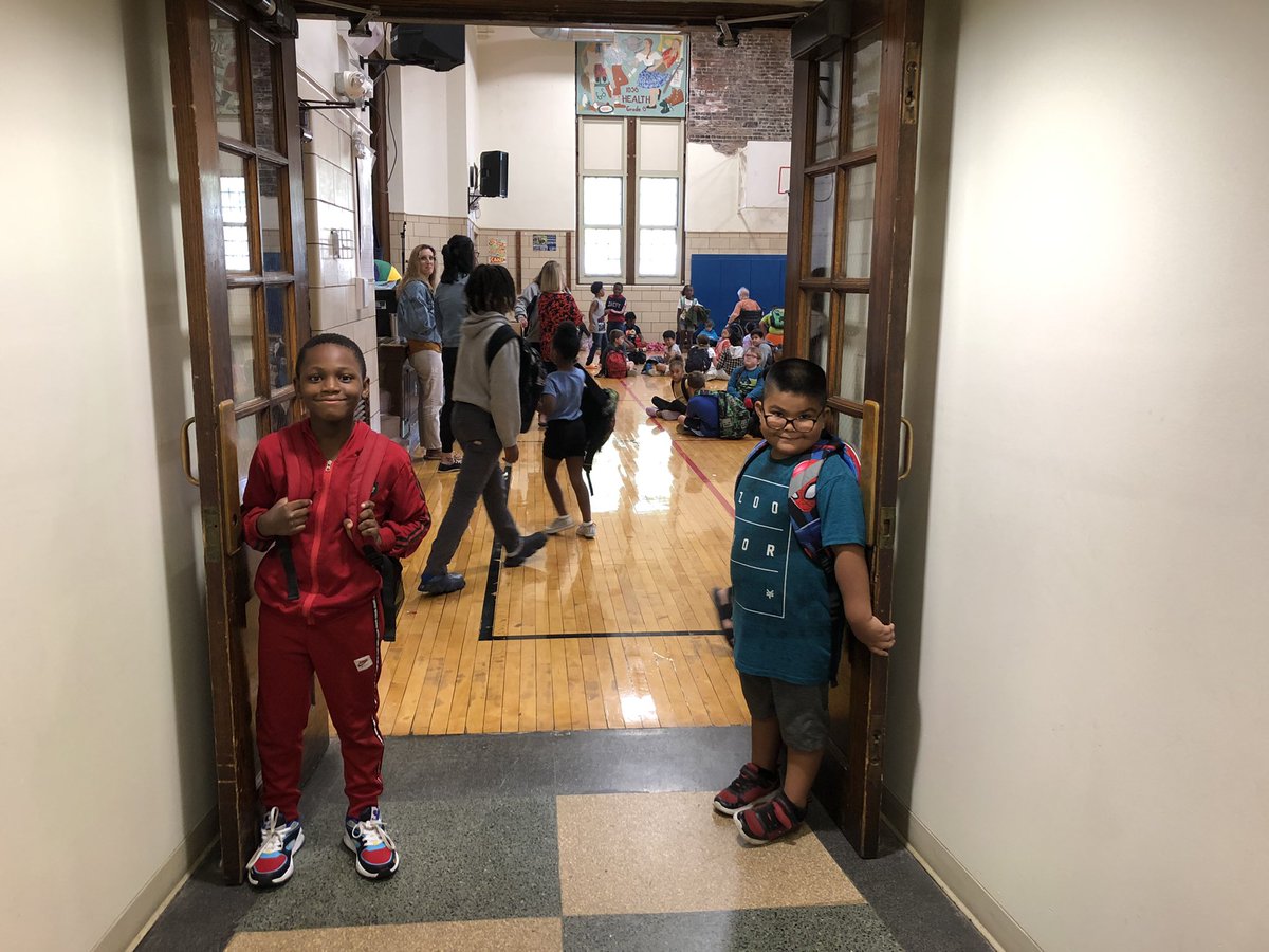 How can you not smile when you start your day with a flower brought to you by this little friend AND walk into Morning Meeting greeted by two leaders who held the door for everyone (without being asked). LOVE our Wolfpack! 💙🤍 Being kind is cool. <a href="/R_I_Schools/">Rock Island-Milan School District #41</a>