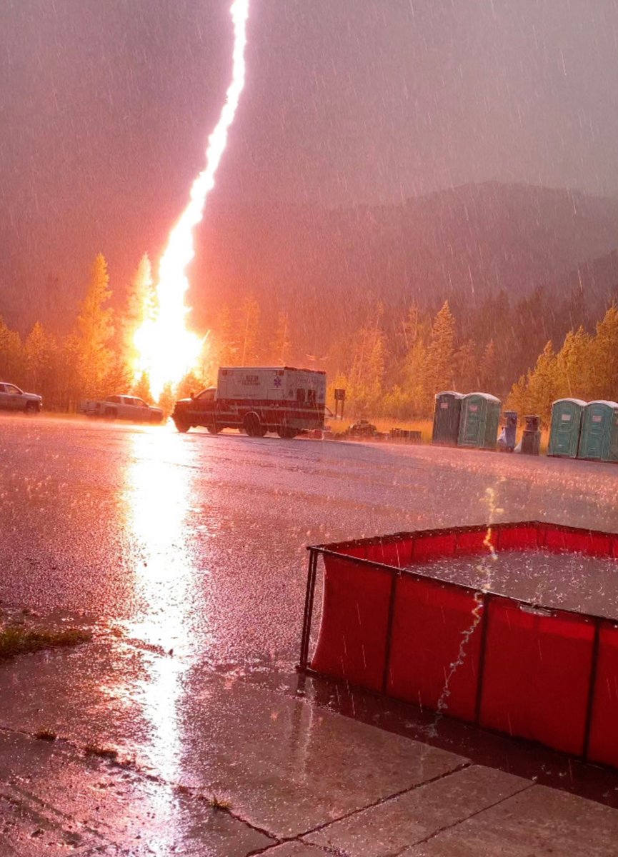 EMTspud's tweet photo. SCARY situation on the Nebo fire in NE Oregon today! Lightning struck just next to where a line ambulance was parked. Nobody hurt, but everything (and everyone) was rattled. Photo credit: Med Transport Inc. #wildfire #wildfires #doublecreekfire https://t.co/udua0VEwdI