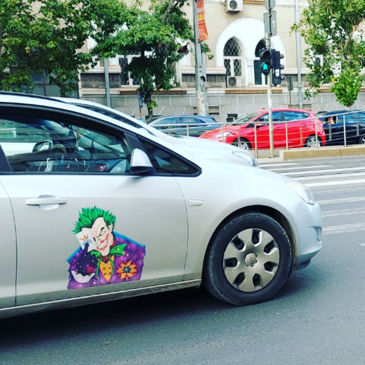 FotoStefan's tweet photo. Watch out for the Joker #fridayfun #FridayVibes #sticker #cars #joker #urbanphotography #thisisbucharest https://t.co/cJ2Uq2tmMo
