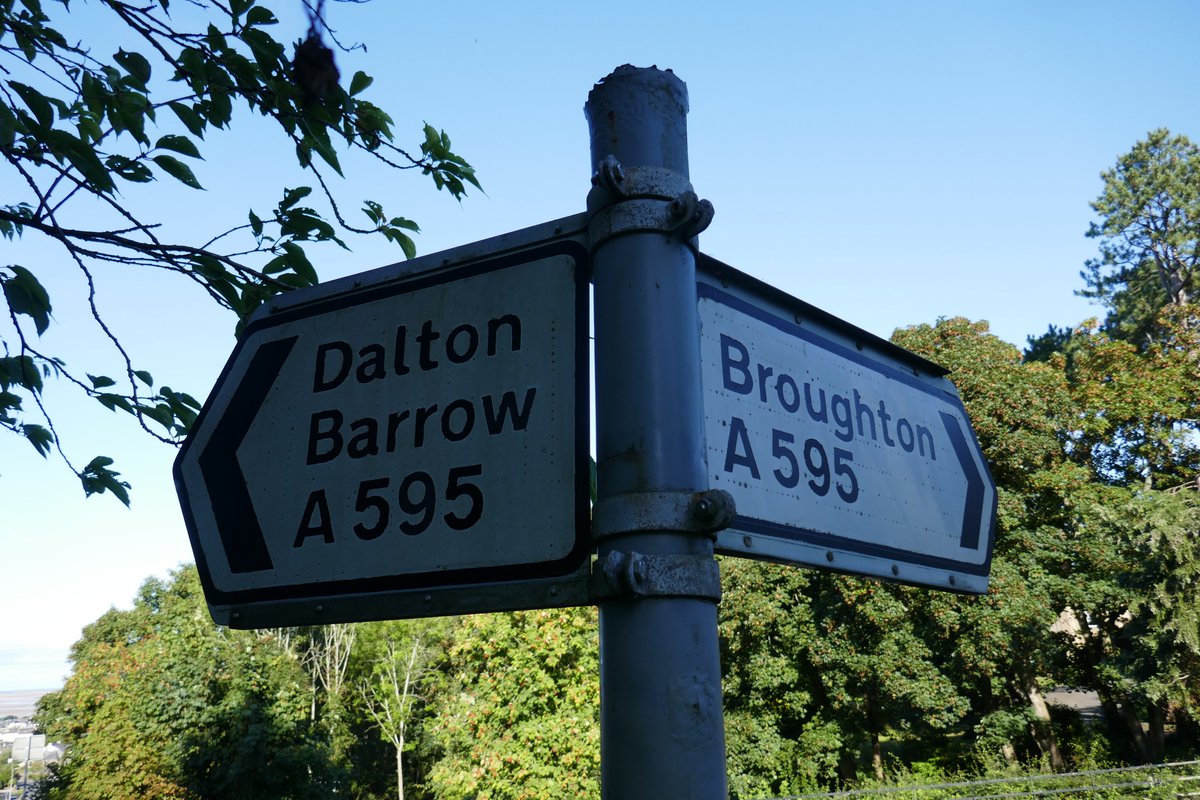 TheLengthsman's tweet photo. A bit of shameful sign cleaning in #Ireleth for #FingerpostFriday as Barrow and Cumbria County Councils don't clean them ! https://t.co/WhCm2ULSxB