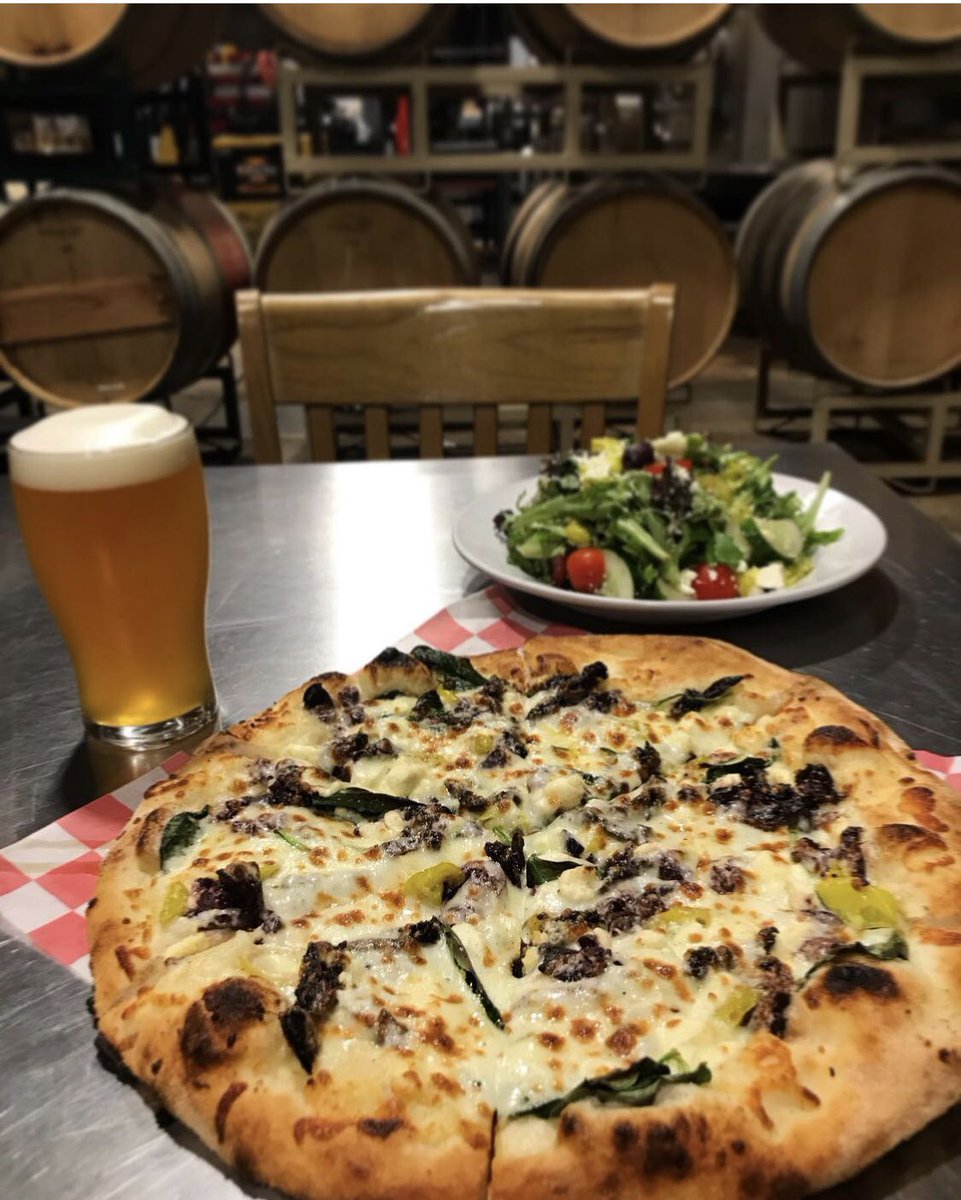 Cheers to the weekend, friends! Come enjoy our fantastic Greek pizza @ the Hangar! Paired here with side Greek salad and Hazy IPA. 🍻🍕