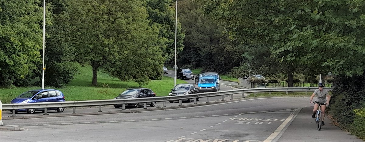 AboutEG's tweet photo. Traffic tailing back along Beeching Way (aka Beeching Cut). How many of the drivers actually want to be in EG? Not many I guess. It's time to address the through-traffic volume issue, as well as improving the road layout and infrastructure to accommodate the increased population. https://t.co/pURFKCBwAr