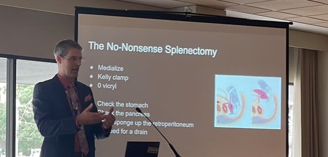 CANUCSurg's tweet photo. Twitter holdout Brad Moffat @westernuSurgery giving a no- nonsense talk on what to do when the trauma finds you at your non- trauma #aloneinthenight 🏥

#csf2022 @TraumaCanada https://t.co/6Tn8PnZaVR