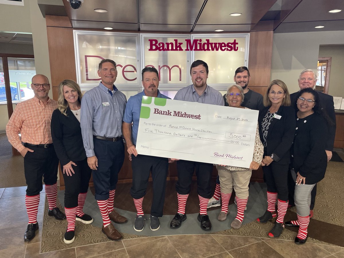 The <a href="/bankmidwest/">Bank Midwest</a> Sioux Falls Team celebrates their 2nd year as a #365GivingTree donor by showing their stripes and also presenting a $5,000 grant we used to update our security camera equipment. Thank you for helping us not only keep families close but to help keep families safe!