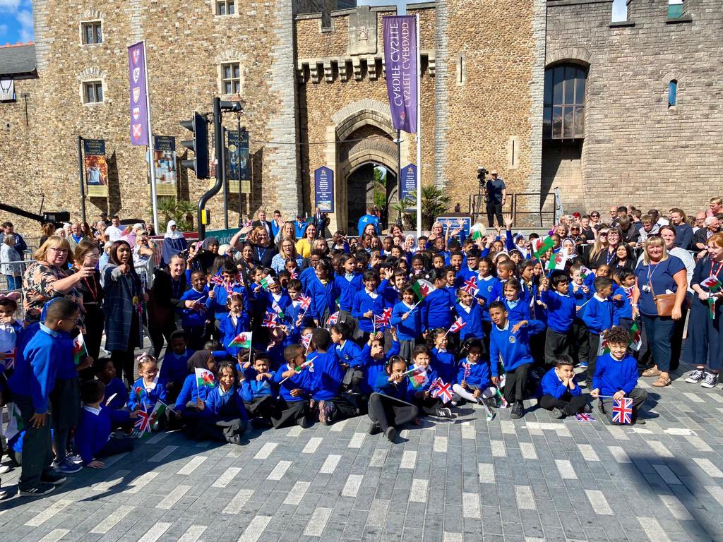 Mrs_Baston's tweet photo. Well it’s not often you can say you’ve been invited to welcome the new King! Such a privilege to stand at @cardiff_castle gates and celebrate with our pupils from years 1-6, as well as all our @SMTVCardiff staff. A day to remember for everyone. https://t.co/FregSoqHTp