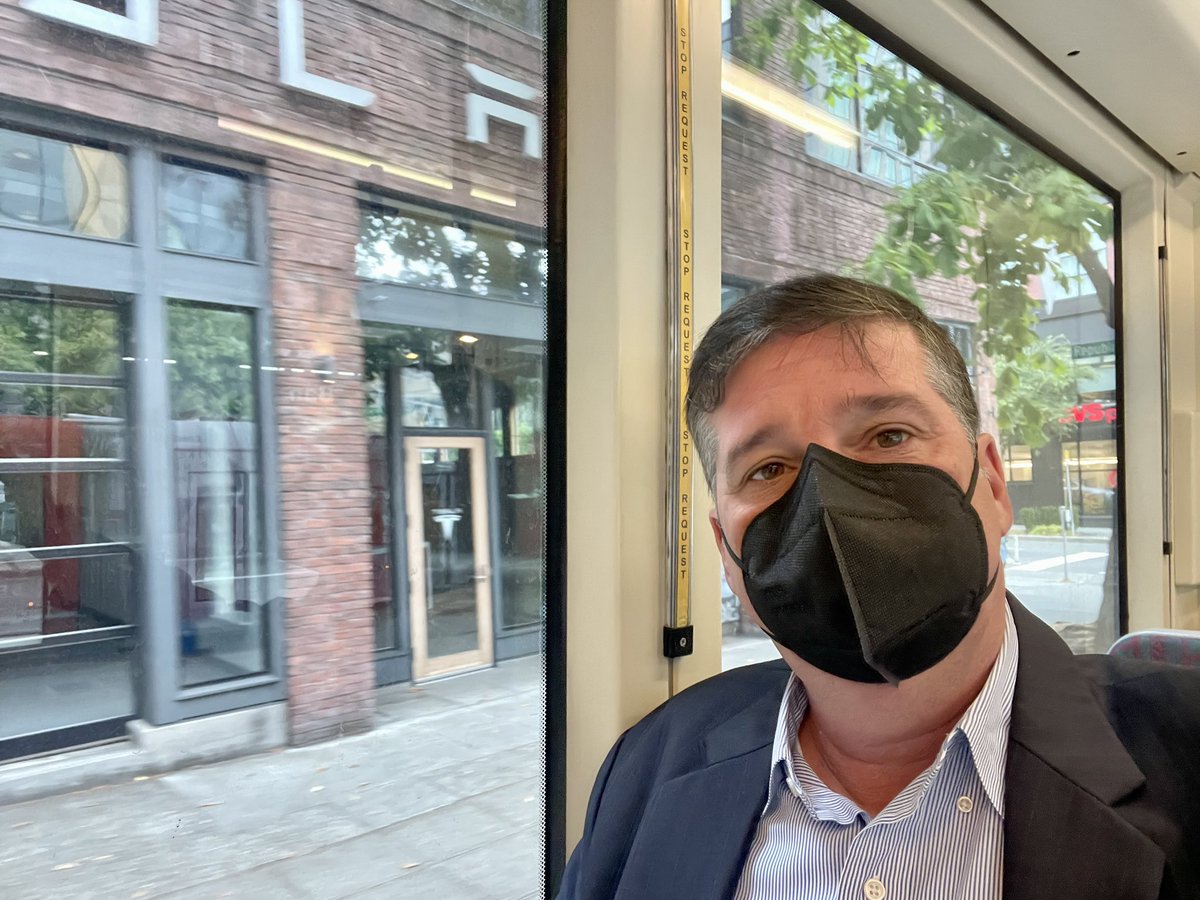 Spottnik's tweet photo. Commuting in by streetcar today wearing a suit: I’m excited about MC’ing the West Seattle Bridge reopening press conf this aft
🚃 
I happened to snap this pic passing a Tesla store- and had the thought that streetcar is electric transportation that someone else drives for you! https://t.co/GZupC3rxUJ