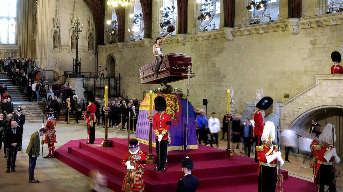 TheOnion's tweet image. Brits Take Turns Mourning Atop Queen’s Bucking Casket bit.ly/3QQdrjz