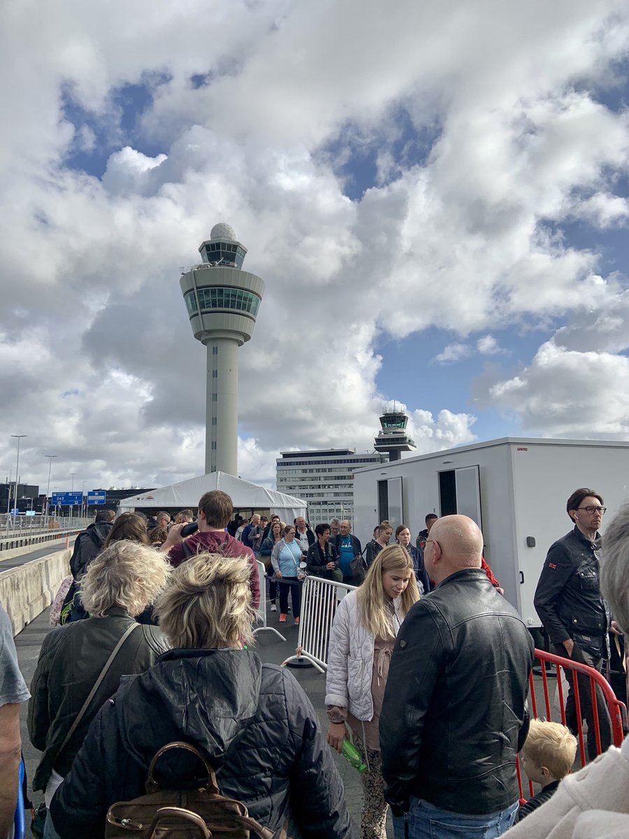 mzjulius's tweet photo. Amsterdam airport lines #AMS are no joke. I’ve been outside for over an hour and nowhere near the terminal. I don’t know how this can even be allowed. Get here at least four hours or more in advance. I’m here 3 hours and will likely miss it. https://t.co/J2tMwHD81r