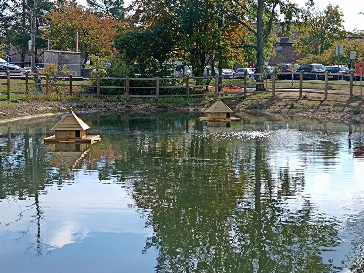 GreenerESNEFT's tweet photo. The Grounds &amp; Gardens team have recently installed new duck houses on the Lake at Colchester Hospital. These houses can accommodate 4 families each and help to protect the ducks and their eggs/ducklings against predators 🦆 https://t.co/8GvADmYU7F
