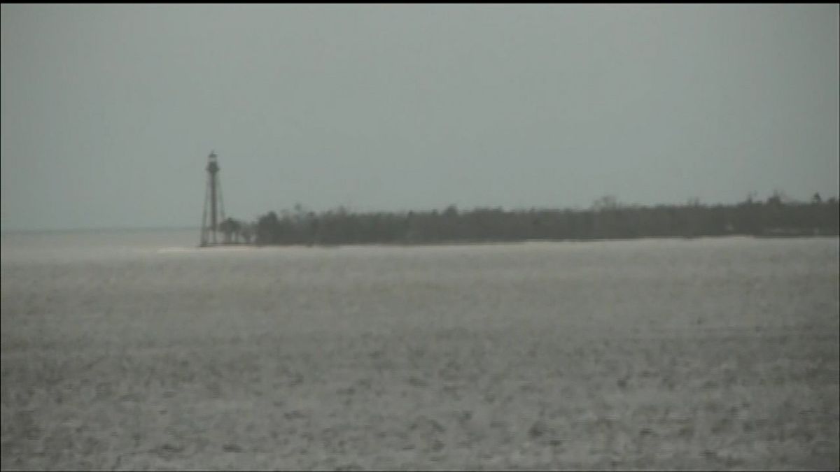 FOX13News's tweet photo. STILL STANDING: Here's a view of Sanibel Lighthouse from this morning. It's still unknown if there was any structural damage. Gov. DeSantis says the causeway that connects the island to the mainland is damaged and will need to be rebuilt. LATEST HERE: https://t.co/3yBeZL1A8U https://t.co/Qilhba0AzK