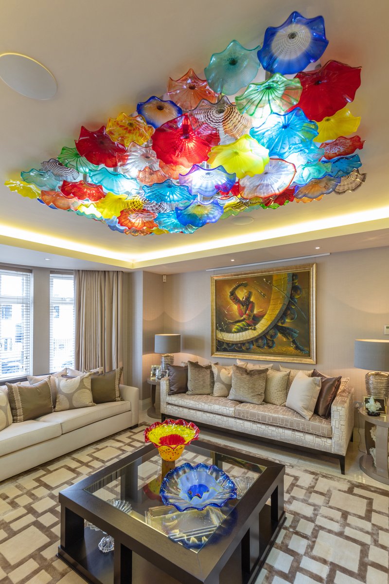 KeyIntDesigns's tweet photo. Above the coffee table is one of our signature, Murano glass light installations in warm marmalade, crimson, azure and amber tones. A recent residential project in London W2 # #project #london https://t.co/CzDxLj5XXq