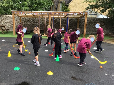BiburySchool's tweet photo. We are enjoying a wide variety of sporting opportunities  with @up_and_undersports. We are learning hockey in PE and running the popular before and after school sports clubs. We are still celebrating after winning our Gold Award for Primary Sports @yourschoolgames. #bibury https://t.co/mUEl8OIeGb