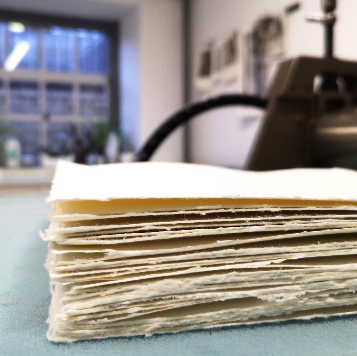 LynnBaileyPrint's tweet photo. Something satisfying about a wadge of freshly cut soft paper waiting to be printed on. Preparing for @2020printexchange organised by @HotBedPress Someone in our workshop needed to drop out so I'm stepping up. Haven't even done my design yet #printmaking #printexchange #hahnemühle https://t.co/OwY3QtjzZK