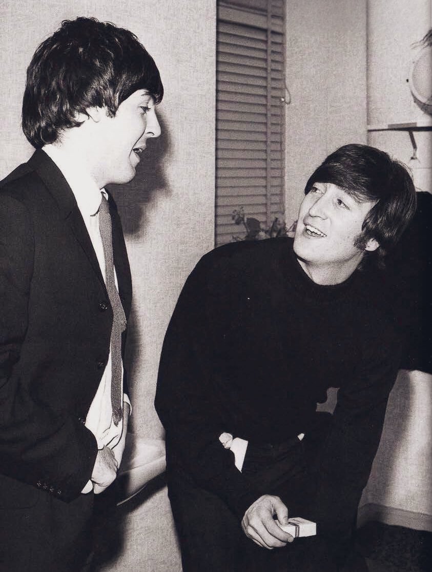 Backstage at the ABC Theatre in Blackpool, John Lennon and Paul McCartney share yet another smile.