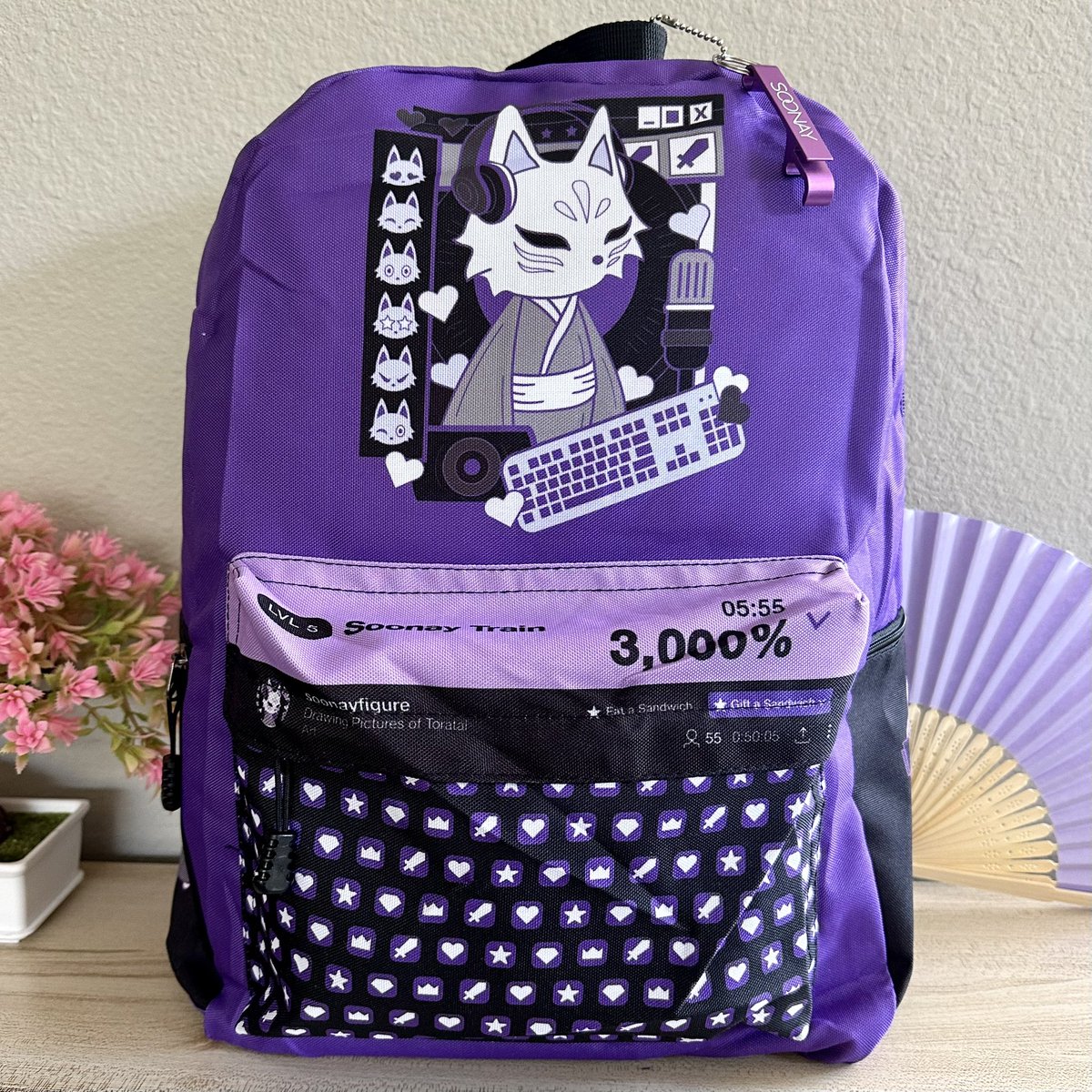 valorandvellum's tweet photo. Hop onto the #Soonay train with this fun streamer inspired backpack! It’s LE 40, $50, comes with a free bottle opener keychain, and it’s exclusive to #TwitchCon2022. Baby got backpack! https://t.co/8WWWYNbL3i