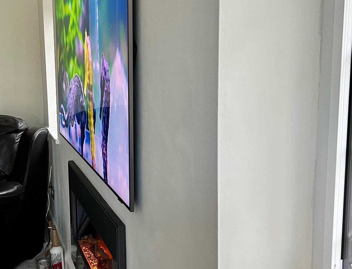 With careful planning, the right bracket for the situation and good cable management you don’t always need a top end Frame or gallery TV to get it fitted tight to the wall.. 
TV connected to Sky Q and Data with no visible cables.
Samsung Qled TV from Richer Sounds.