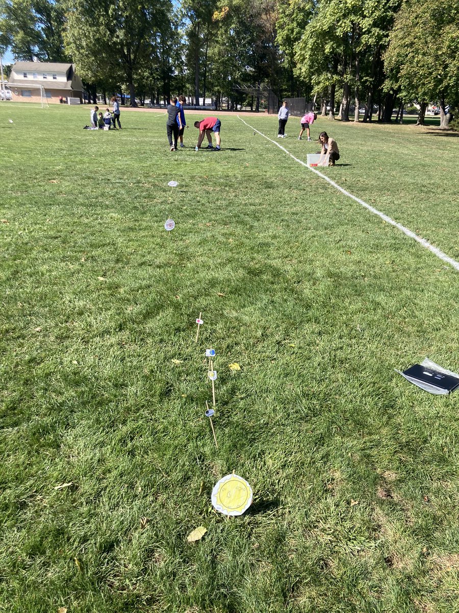 Mrs. Gallanthen and Mr. Fluri scaling the solar system in their 8th grade science class. Awesome!