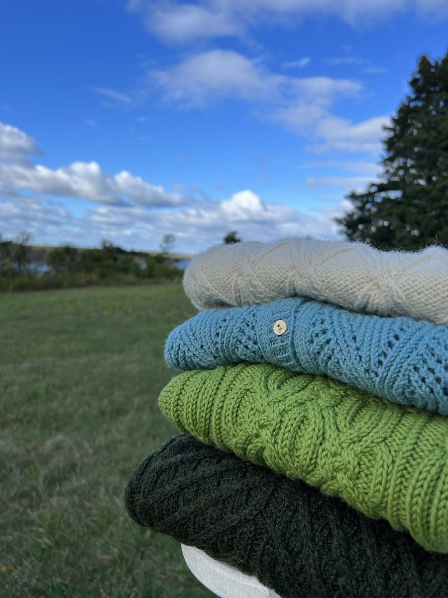 AnnLinkReville's tweet photo. Not a bad little collection. Still needs some work and I may add a couple other sweaters for this weekend's showing but I really like what I've made so far! #knitting https://t.co/fkjumLJrck