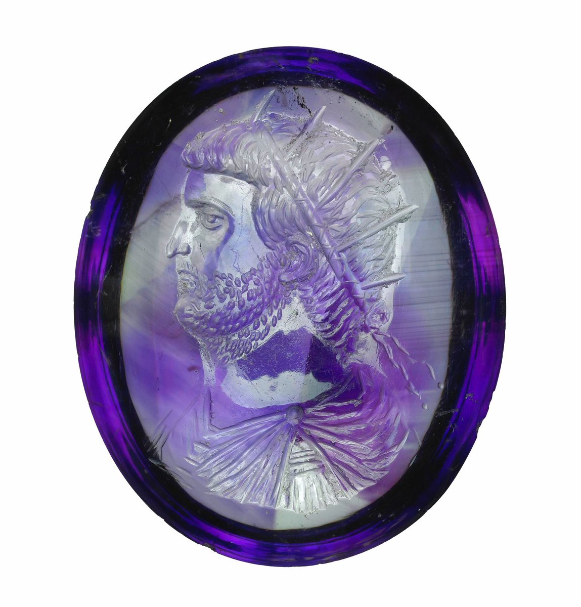 Engraved oval amethyst intaglio with the portrait of the Roman emperor Valerian. He's wearing a radiate crown and fillet, and sports an unfortunate neckbeard. 3rd c. CE, of course, as in 'Crisis of the Third Century'. Not a fun time to be emperor. #BritishMuseum