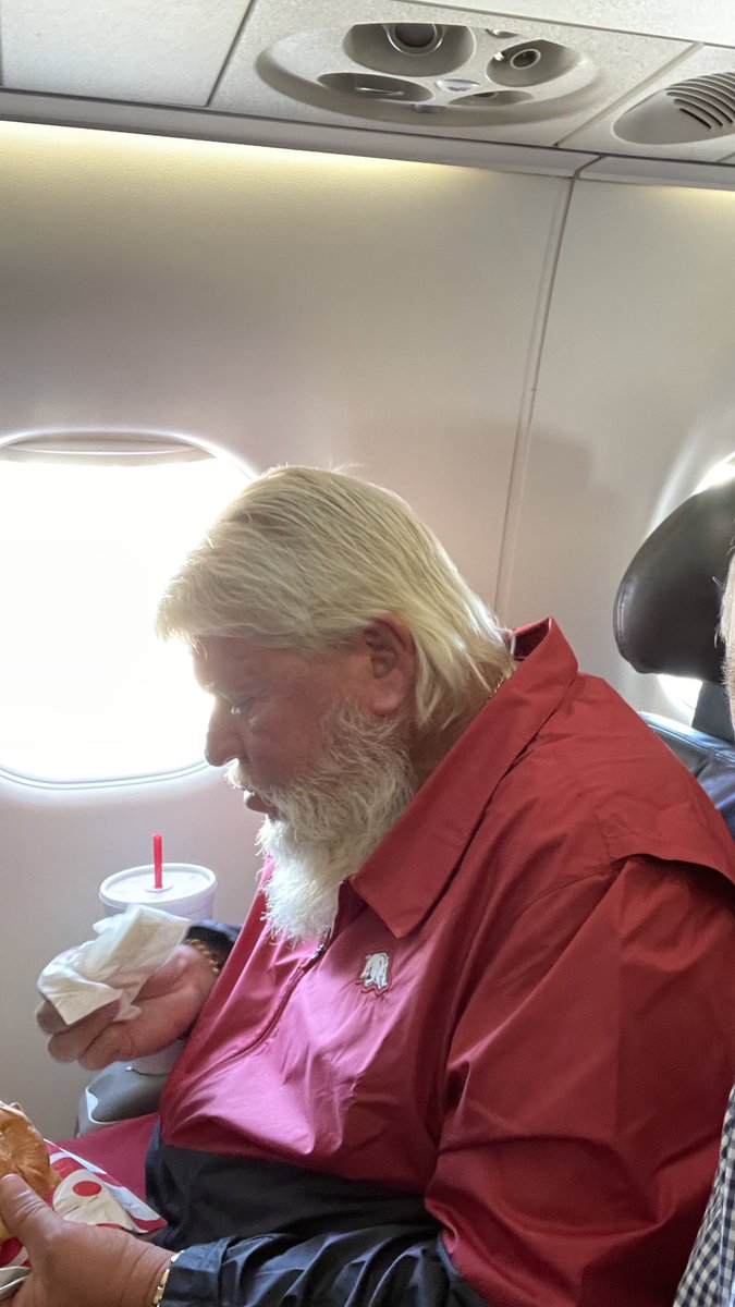 Sitting next to John Daly on the plane. One perk of traveling so much.