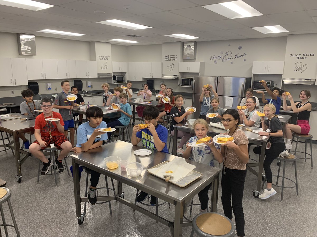 6th graders working on their second lab and enjoying their Breakfast Pizza.