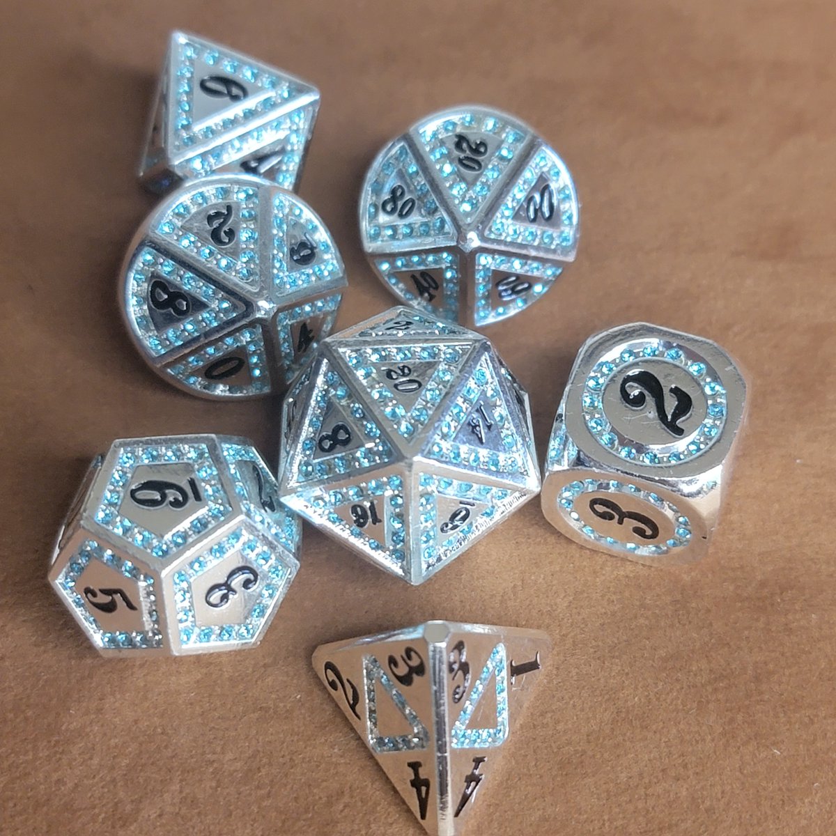 ModernArtifice's tweet photo. Queens Jewels Dice Giveaway! 
Rules: 
1. Follow Us
2. Share this post.
3. Tag a Noble
#diceset #dice #dnd #onednd #dnd5e #pathfinder #metaldice #gemstone #shiny #gem #giveaway #royalty #king #queen https://t.co/ImtP2uAMsJ
