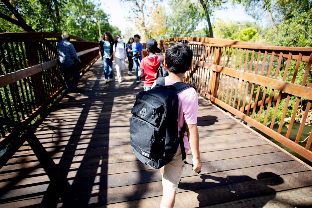 Before the bridge to Backman Elementary was built, little ones walked beside a busy road to get to and from school. Today we celebrated this bridge, which began as an idea from the community and is now a tangible infrastructure project that safely ushers kids in their community.