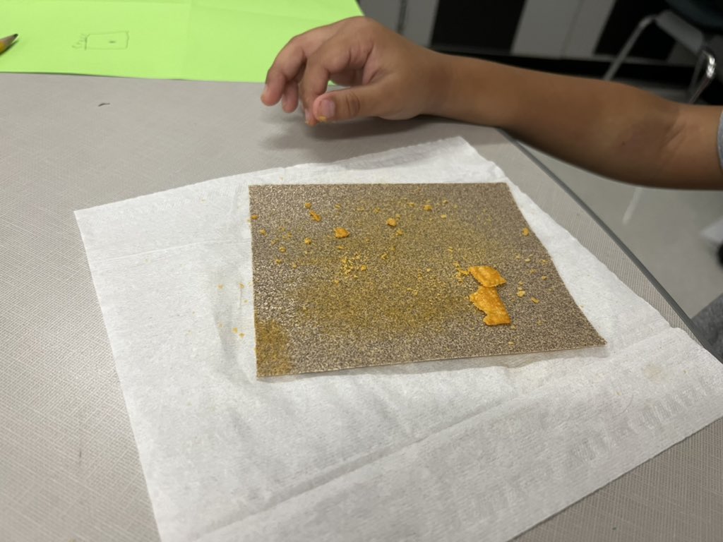 MissCress's tweet photo. My students using sand paper to sand crackers! They were working to see how the physical properties changed. https://t.co/iLHlMgWTte