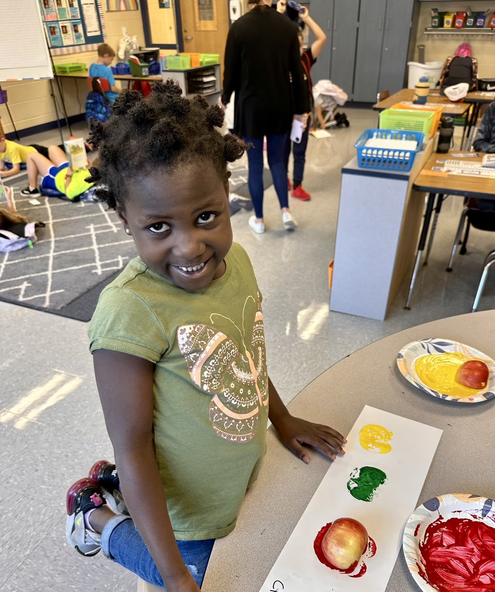 Learning about Johnny Appleseed and then creating artwork with apple stamps!