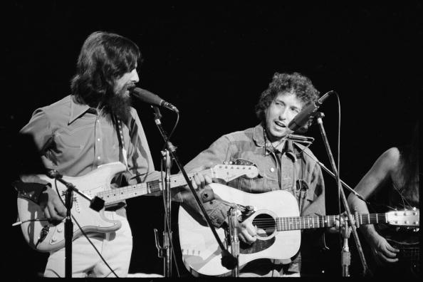 George Harrison and Bob Dylan performing together during the Concert For Bangladesh at Madison Square Garden, 1971. Photo by Bill Ray