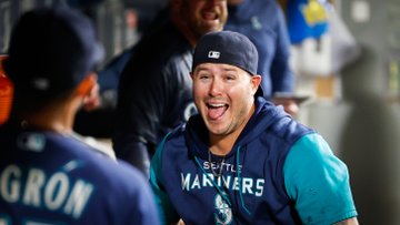 Ty France smiles in the dugout.