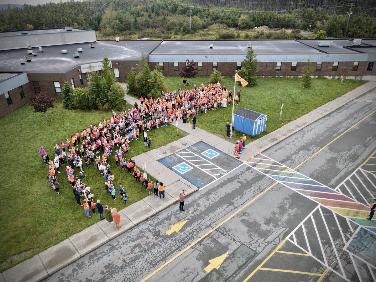 Thanks to @BCEHare for getting her husband Josh to capture this drone shot of our flag raising ceremony yesterday. #NDTR2022 #OrangeShirtDay2022 @NLESDCA @EDU_GovNL